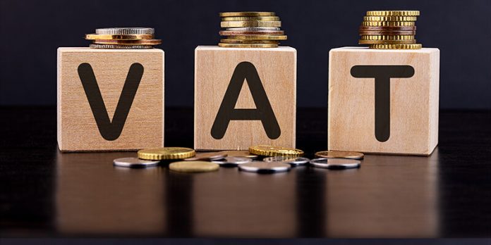 An image of coins and blocks that spell out VAT